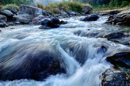 Reshi River water flowing on rocks at dawn,  Sikkim, Indiaの写真素材