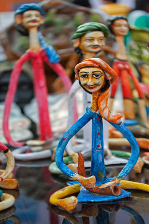 KOLKATA, WEST BENGAL , INDIA - DECEMBER 14TH 2013   An handicraft artwork on people, on display during the Handicraft Fair in Kolkata - the biggest handicrafts fair in Asia のeditorial素材