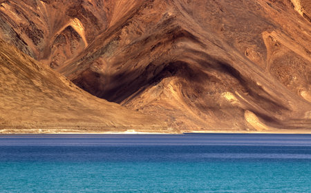 Play of light and shadow on mountains of Pangong tso (Lake). It is huge lake in Ladakh, It is 134 km long and extends from India to Tibet. Leh, Ladakh, Jammu and Kashmir, Indiaのeditorial素材