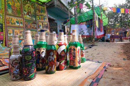 PINGLA, WEST BENGAL , INDIA - NOVEMBER 16TH 2015 : Colourful handicrafts are being prepared for sale in Pingla village. Handicrafts are popular rural Industry in West Bengal.のeditorial素材