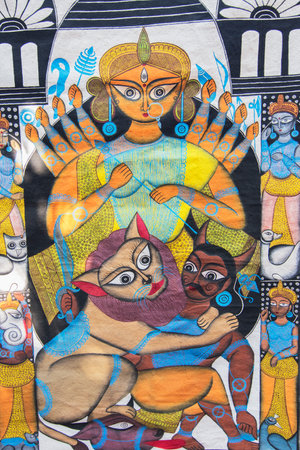 PINGLA, WEST BENGAL , INDIA - NOVEMBER 16TH 2014 : Durga idol, colourful handicrafts are being prepared for sale in Pingla village by Indian worker. Handicrafts are rural Industry in West Bengal.のeditorial素材