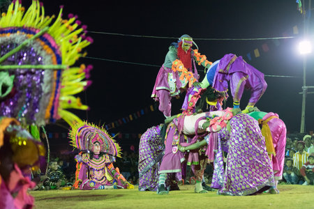BAMNIA, PURULIA, WEST BENGAL , INDIA - DECEMBER 23RD 2015 : Dancers performing at Chhau Dance festival. It is a very popular Indian tribal martial dance performed at night amongst spectators.のeditorial素材