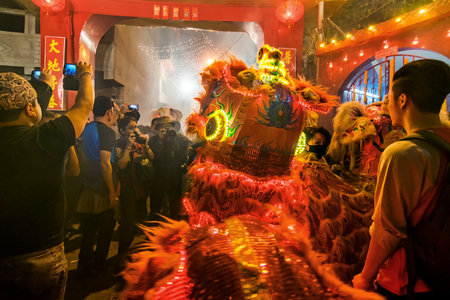 KOLKATA, WEST BENGAL  INDIA - FEBRUARY 7TH : Unidentified photographers taking pictures of the red dragon, celebration of Chinese New Year, on 07.02.16. It is the year of the monkey, as per chinese calender.のeditorial素材