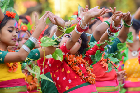 KOLKATA , INDIA - MARCH 5, 2015 : Girl child dancers performing at Holi  Spring festival, known as Dol in Bengali or Holi in Hindi celebrating arrival of Spring in India. A very popular festival amongst Bengalis.のeditorial素材