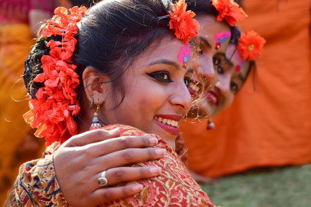 KOLKATA , INDIA - MARCH 5, 2015 : Young girl dancer's joyful expression at Holi  Spring festival, known as Dol in Bengali or Holi in Hindi celebrating arrival of Spring in India. A very popular festival amongst Bengalis.のeditorial素材