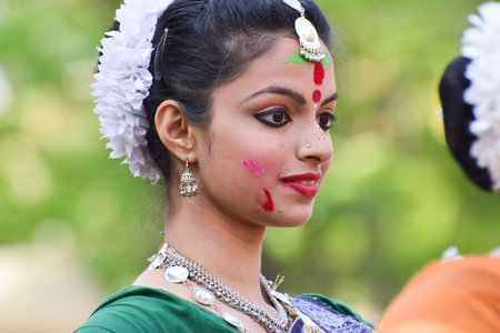 KOLKATA , INDIA - MARCH 5, 2015 : Young girl dancers performing at Holi  Spring festival, known as Dol in Bengali or Holi in Hindi celebrating arrival of Spring in India. A very popular festival amongst Bengalis.のeditorial素材