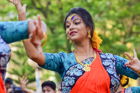 KOLKATA , INDIA - MARCH 5, 2015 : Young girl dancers performing at Holi  Spring festival, known as Dol in Bengali or Holi in Hindi celebrating arrival of Spring in India. A very popular festival amongst Bengalis.のeditorial素材