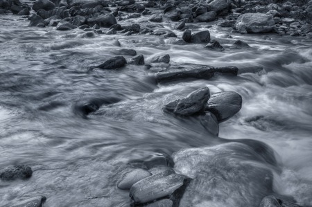Beautiful Reshi River water flowing through stones and rocks at dawn,  Sikkim, India. Reshi is one...