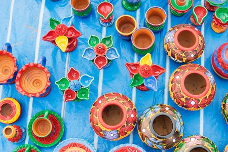 Colorful potteries made of clay, handicrafts on display during the Handicraft Fair in Kolkata ,...
