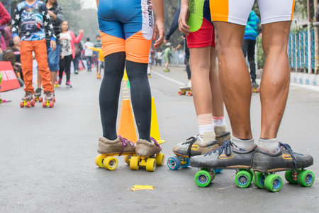 KOLKATA, WEST BENGAL, INDIA - JANUARY 17TH 2016 : Unidentified city children rollerskating on blocked, otherwise busy,Park Street for "Happy Street" event. Children played, enjoyed and had fun.のeditorial素材