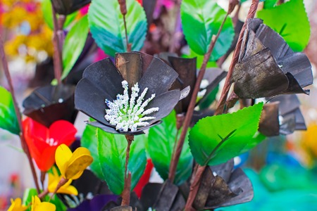 Artificial flowers made out of colored plastics, handicrafts on display during the Handicraft Fair in Kolkata , earlier Calcutta, West Bengal, India. It is the biggest handicrafts fair in Asia.の写真素材