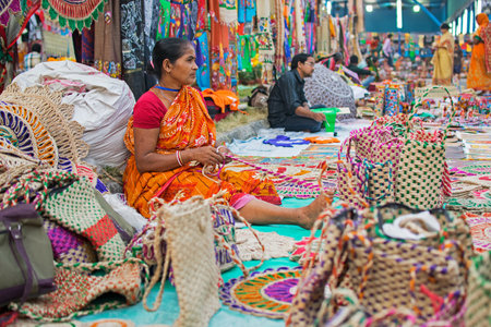 Kolkata, West Bengal, India - 28th November, 2015 : Woman hand weaving jute bags, handicrafts on display during the Handicraft Fair in Kolkata. Biggest handicrafts fair in Asia.のeditorial素材