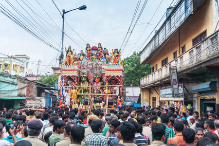 KOLKATA, WEST BENGAL , INDIA - 12TH AUGUST 2012 : Religious Hindu devotees pulling ropes of procession Lord Ram. Ram is a Hindu God, based on whose life, epic story "Ramayana" was written thousand of years ago.のeditorial素材