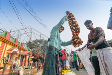 KOLKATA, WEST BENGAL / INDIA - FEBRUARY 13TH : Buying and selling of flowers in crowded and colorful Mallik Ghat or Jagannath ghat flower market in Kolkata , on 13.02.16. One of Biggest flower markets in Asia.のeditorial素材