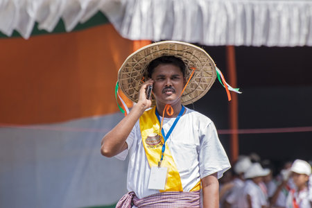 KOLKATA, WEST BENGAL / INDIA - AUGUST 15TH, 2016 : Man dressed in villager's dress, talking in mobile, as a symbol of digital India campaign , to celebrate on India's Independence day. Celebrated all over India .のeditorial素材