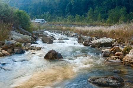 Beautiful Reshi River water flowing through stones and rocks at dawn, Sikkim, India. Reshi is one of...