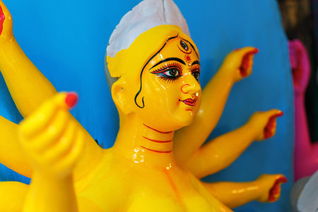 KOLKATA, WEST BENGAL, INDIA - 25 SEPTEMBER 2016: Clay idol of Goddess Durga, under preparation for