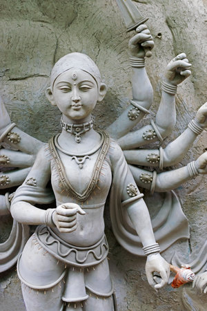 KOLKATA, WEST BENGAL, INDIA - 25 SEPTEMBER 2016: Clay idol of Goddess Durga, under preparation for