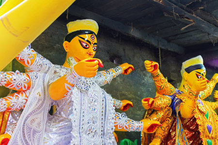 KOLKATA, WEST BENGAL, INDIA - 25 SEPTEMBER 2016: Clay idol of Goddess Durga, under preparation for "Durga Puja' festival in Kumartuli, Kolkata. Biggest festival of Hinduism.のeditorial素材