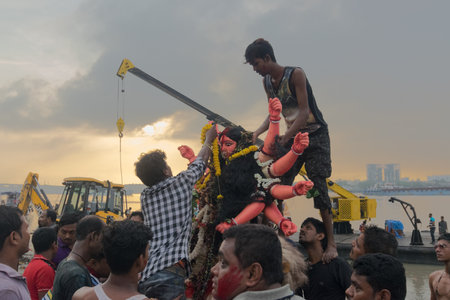 KOLKATA, WEST BENGAL, INDIA - 30 SEPTEMBER 2017: Idol of Goddess Durga is being immersed in Holy...