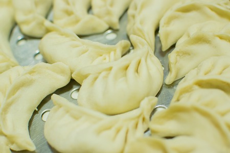 Momo , type of South Asian dumpling; native to Tibet, Nepal, Bhutan and Sikkim. It is similar to Chinese baozi and jiaozi, Mongolian buuz, Japanese gyoza and Korean mandu. Stock photograph.の写真素材
