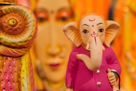 Colorful dolls made of clay, Lord Ganesha, handicrafts on display during the Handicraft Fair in...