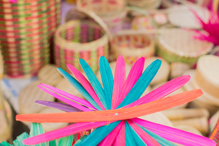 Cane made artificial colored flowers, handicrafts on display in Handicraft Fair in Kolkata - the biggest handicrafts fair in Asia.の写真素材