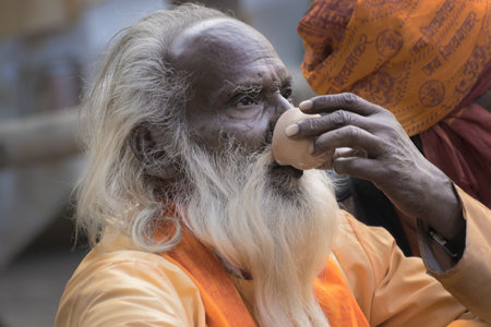 BABUGHAT, KOLKATA, WEST BENGAL / INDIA - 10TH JANUARY 2015 : Portrait of Hindu Sadhu with white...
