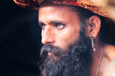 BABUGHAT, KOLKATA, WEST BENGAL / INDIA - 10TH JANUARY 2015 : Portrait of Hindu Sadhu aginst dark background.のeditorial素材