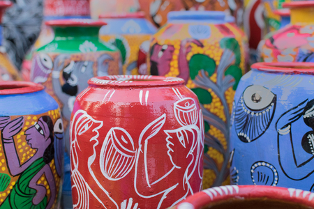 Bright colorful terracotta pots, works of handicraft, on display during Handicraft Fair in Kolkata - the biggest handicrafts fair in Asia.の写真素材
