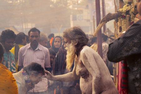 BABUGHAT, KOLKATA, WEST BENGAL / INDIA - 11TH JANUARY 2015 : Hindu Sadhu with white ash applied on...