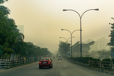 KOLKATA, WEST BENGAL , INDIA - NOVEMBER 27TH 2016 : Eastern Metrapolitan Bypass of Kolkata - a road to Kolkata airport. Winter moring shot.のeditorial素材