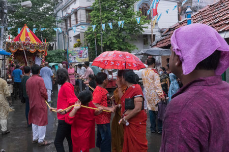 HOWRAH, WEST BENGAL , INDIA - JULY 14TH 2018 : Devotees dragging ropes of Rath (chariot) of God Jagannath, Balaram and Goddess Suvadra as ritual. rath jatra festival.のeditorial素材