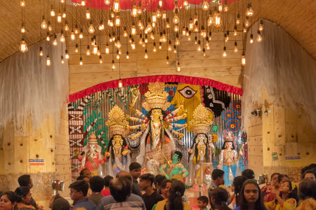 KOLKATA , INDIA - SEPTEMBER 26, 2017 : Goddess Durga idol inside decorated Durga Puja pandal, shot at colored light . Durga Puja is biggest religious festival of Hinduism.のeditorial素材
