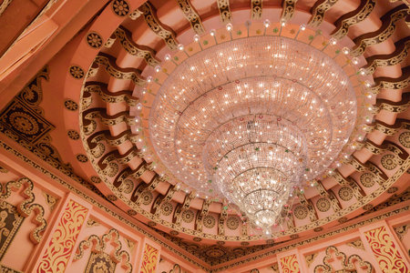 KOLKATA , INDIA - SEPTEMBER 26, 2017 : Huge beautiful chandelier hanging inside decorated Durga Puja pandal, shot at colored light. Durga Puja is biggest religious festival of Hinduism and Bengalis.のeditorial素材
