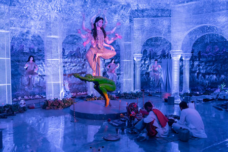 KOLKATA , INDIA - SEPTEMBER 28, 2017 : Goddess Durga idol inside decorated Durga Puja pandal, shot...