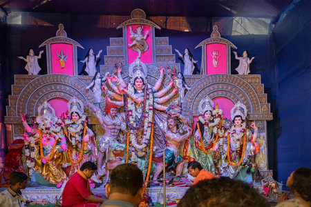 KOLKATA , INDIA - SEPTEMBER 28, 2017 : Goddess Durga idol inside decorated Durga Puja pandal, shot...