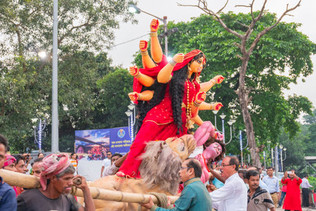 KOLKATA, WEST BENGAL, INDIA - 30 SEPTEMBER 2017: Idol of Goddess Durga is being immersed in Holy river Ganges, calledのeditorial素材