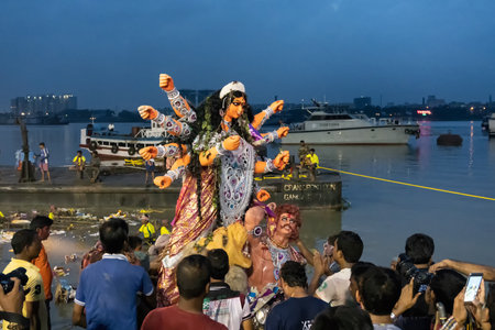KOLKATA, WEST BENGAL, INDIA - 30 SEPTEMBER 2017: Idol of Goddess Durga is being carried to holy river ganges for immersion, calledのeditorial素材