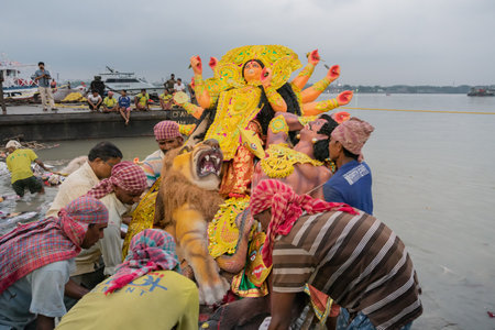KOLKATA, WEST BENGAL, INDIA - 30 SEPTEMBER 2017: Idol of Goddess Durga is being carried to holy river ganges for immersion, calledのeditorial素材