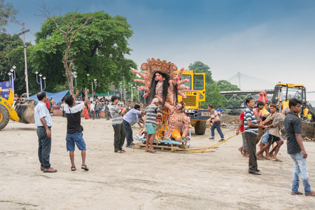 KOLKATA, WEST BENGAL, INDIA - 30 SEPTEMBER 2017: Idol of Goddess Durga is being carried to holy river ganges for immersion, calledのeditorial素材