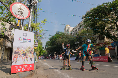 KOLKATA, WEST BENGAL, INDIA - MARCH 15th 2015 : Children rollerskating on Park Street forのeditorial素材