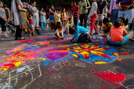 KOLKATA, WEST BENGAL, INDIA - MARCH 1ST 2015 : Children sitting on street and painting Park street...