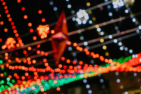 Blurred decorative festival overhead lights - shot with manual focus in camera. For use as background and copyspace.の写真素材