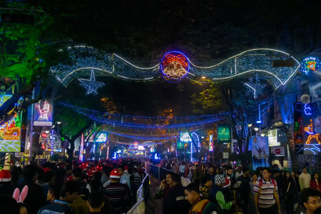 KOLKATA, WEST BENGAL, INDIA - DECEMBER 25TH 2017 : Beautiful decorated lighting of Merry Christmas at night at Park Street, Kolkata. People celebrating Merry Christmas.のeditorial素材