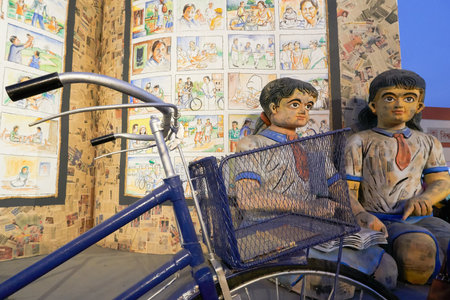KOLKATA, INDIA - FEBRUARY 11TH , 2018 : Big sculpture of children, books and cycle on display for promotion of books at Kolkata book fair. It is world's largest and most attended book fair.のeditorial素材