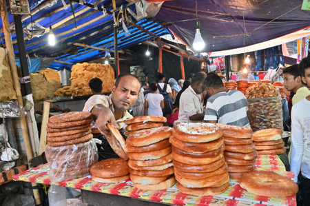 KOLKATA, WEST BENGAL, INDIA - MAY 27 2019 : Fresh local bakery made biscuits being sold in Jakaria or Zakaria street , near Nakhoda Mashid in Kolkata. This place is famous fast food zone for all.のeditorial素材