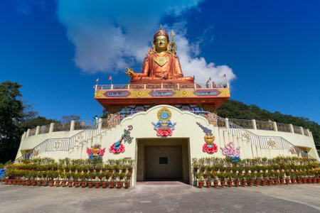 Samdruptse statue , a huge buddhist memorial statue in Sikkim, blue cloudy sky in background.のeditorial素材
