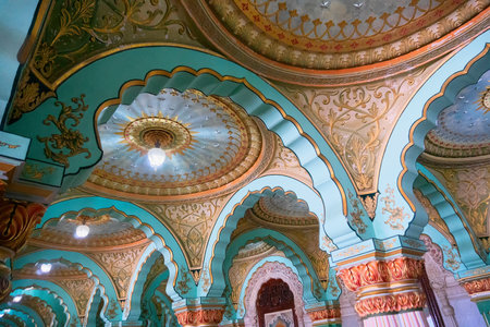 Mysore, Karnataka, India - November 25th 2018 : Beautiful decorated interior ceiling and pillars of the Durbar or audience hall inside the royal Mysore Palace. A very famous tourist attraction.のeditorial素材