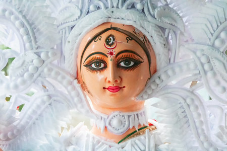 Kolkata, West Bengal, India - 7th October 2018 : Clay idol face of Goddess Durga, with white dress for Durga Puja festival. Biggest festival of Hinduism, celebrated all over the world.のeditorial素材